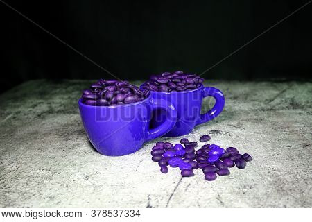 Ceramic Espresso Cups And Coffee Beans On A Concrete Board