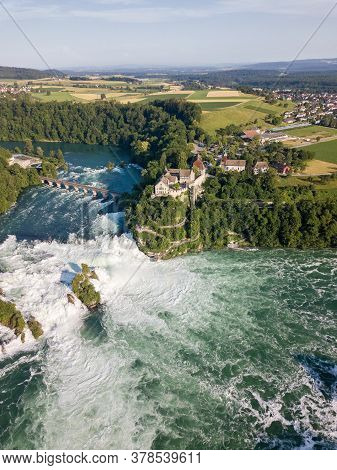 Aerial View By Drone Of Rhine Falls With Schloss Laufen Castle, Switzerland. Rhine Falls Is The Larg