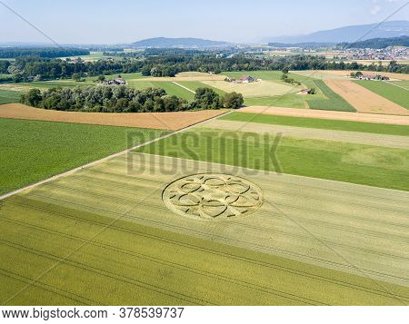 Canton Bern, Switzerland - July 05, 2019: Mysterious Crop Circle Emerged Overnight In Wheat Field Wi
