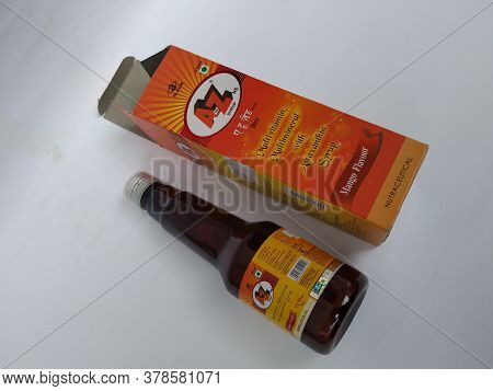 Closeup Of A To Z Ns Multi Vitamin And Mineral, Mango Flavour 200 Ml Syrup Bottle And Pack Isolated