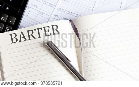 Barter Word Written On Notebook With Pen,chart And Calculator