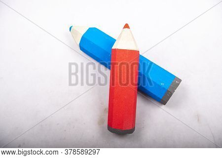 Blue And Red Pencil Stands On A White Background