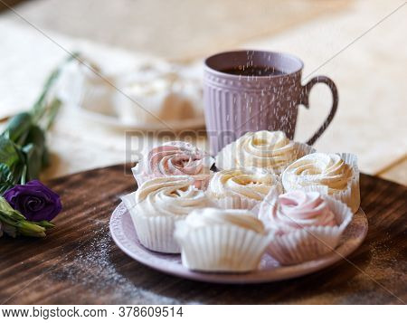 Confectioner Sprinkles Icing Sugar With Dessert. Powder Sugar Falls On Fresh Perfect Cupcakes Or Mer