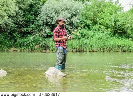 Man Bearded Fisherman. Fish Farming Pisciculture Raising Fish Commercially. River Lake Lagoon Pond. 
