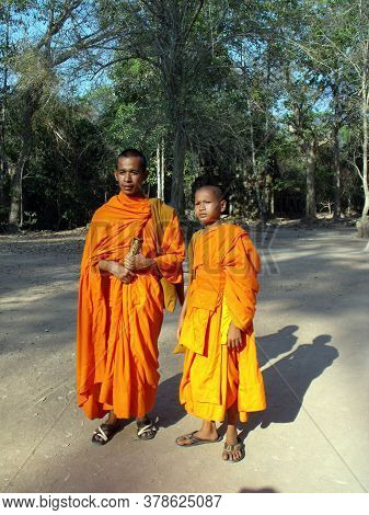 Angkor Wat, Siem Reap, Cambodia, April 6, 2016: Two Young Buddhist Monks At The Angkor Wat Temple In