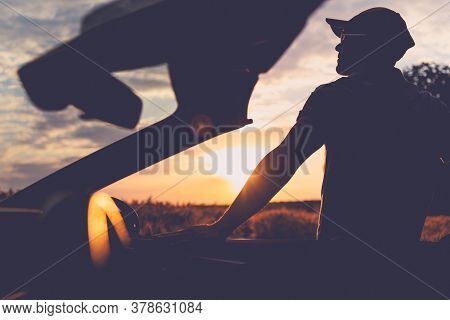 Caucasian Men In His 40s Enjoying Scenic Moment During Golden Hour Sunset. Recreational Convertible 