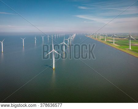 Windmill Park Westermeerdijk Netherlands, Wind Mill Turbine With Blue Sky In Ocean, Green Energy