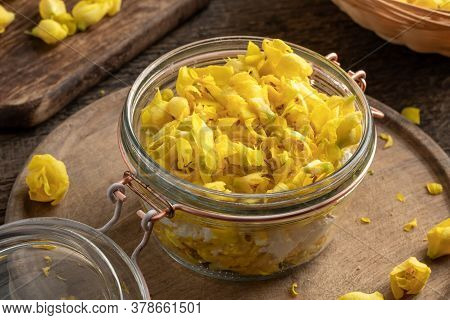 A Glass Jar Filled With Fresh Denseflower Mullein Flowers And Sugar, To Prepare Homemade Syrup Again