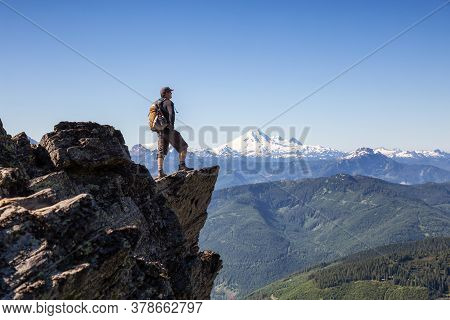 Adventurous Person Hiking In The Canadian Mountains During A Sunny Summer Morning. Taken On The Trai