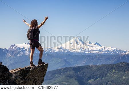 Adventurous Person Hiking In The Canadian Mountains During A Sunny Summer Morning. Taken On The Trai