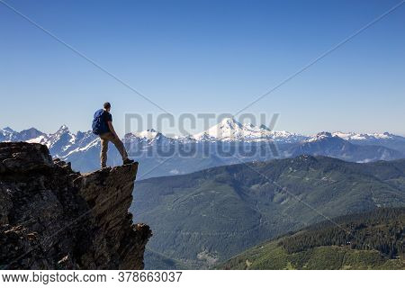 Adventurous Person Hiking In The Canadian Mountains During A Sunny Summer Morning. Taken On The Trai