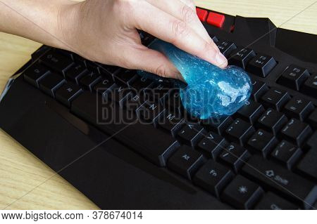 Blue Soft Gel Cleaning Dust On Keyboard. Concept Cleaning Your Computers Keyboard.