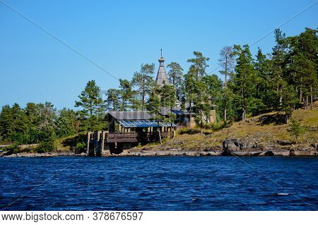 A Wooden Chapel In Honor Of All The Valaam Saints. Beautiful Nature Of The Valaam Archipelago On A C
