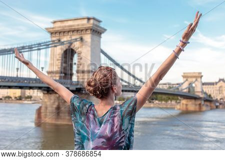 Thankful Redhead Young Woman Arms Raised At Budapest, Hungary