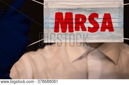 Doctors Hands In Blue Gloves Shows The Word Mrsa Methicillin-resistant Staphylococcus Aureus. Medica