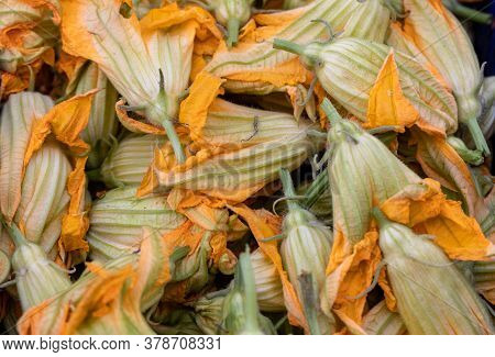 Fresh Zucchini Flowers At A Farmers Market In Italy