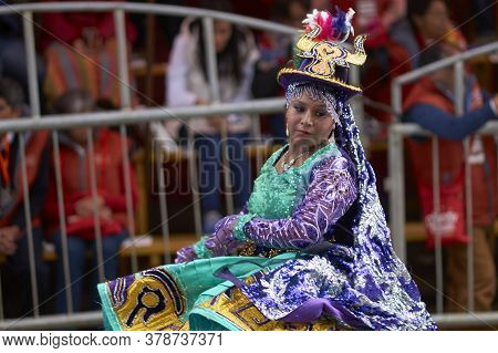 Oruro, Bolivia - February 25, 2017: Members Of A Waca Waca Dance Group In Ornate Costume Parade Thro