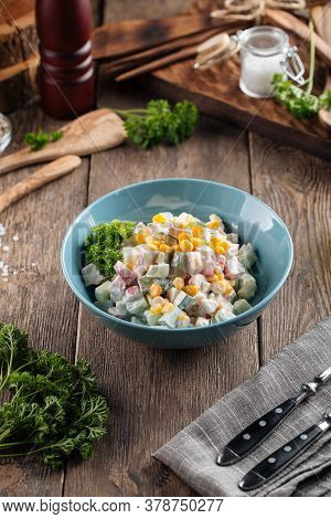 Russian Salad With Crab Sticka And Corn Dressed With Mayonnaise