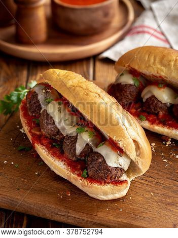 Meatball Sandwich With Tomato Sauce And Cheese On A Hoagie Roll