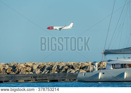 Cagnes- Sur-mer, France 24.07.2020. Flying Plane Over The Sea With Yachts. High Quality Photo