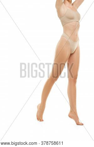 Beautiful Female Legs, Buttlocks And Belly Isolated On White Background. Beauty, Cosmetics, Spa, Dep