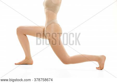 Beautiful Female Legs, Buttlocks And Belly Isolated On White Background. Beauty, Cosmetics, Spa, Dep