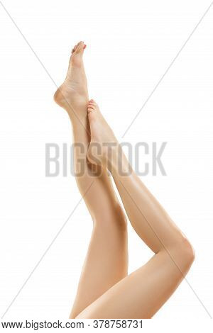 Tender Touch. Beautiful Female Legs Isolated On White Background. Beauty, Cosmetics, Spa, Depilation