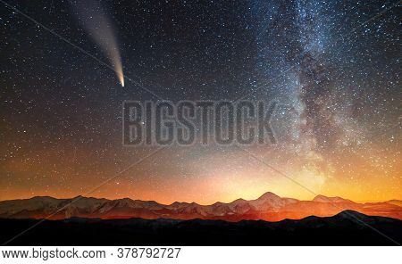 Surreal View Of Night In Mountains With Starry Dark Blue Cloudy Sky.