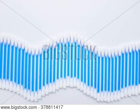 Ear Sticks With Blue Plastic On A White Background. Personal Hygiene And Self-care. Cosmetology And 