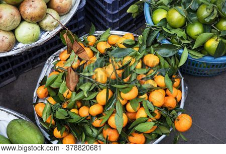 ripe tangerines at the market on a street