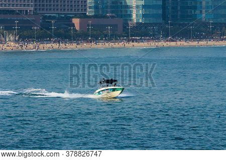 Busan,south Korea-may 2014: People Riding A Jet Ski On Blue Ocean In Haeundae Beach, Oryukdo Island.