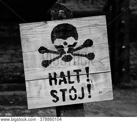 Sign With A Skull And The Inscription Alt In The Auschwitz Concentration Camp