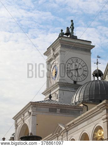 Ancient Monument With The Clock Tower In The Main Square Of The City Of Udine In Northern Italy