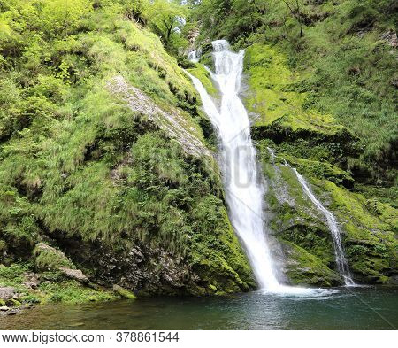 Breathtaking Uncontaminated Environment Surrounded By Nature And A Cascade Of Fresh Water That Flows