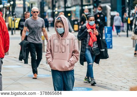 Manchester, England, Uk - 24 July, 2020 City Centre Of Manchester, People In Face Masks While Shoppi