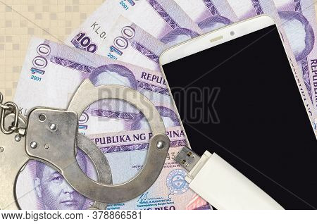 100 Philippine Piso Bills And Smartphone With Police Handcuffs. Concept Of Hackers Phishing Attacks,