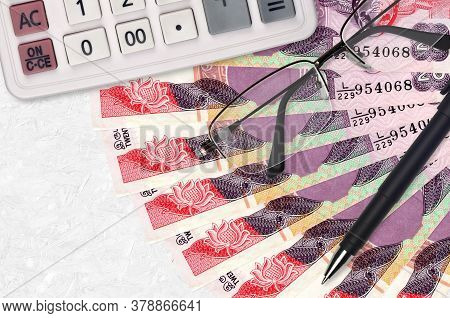 20 Sri Lankan Rupees Bills Fan And Calculator With Glasses And Pen. Business Loan Or Tax Payment Sea