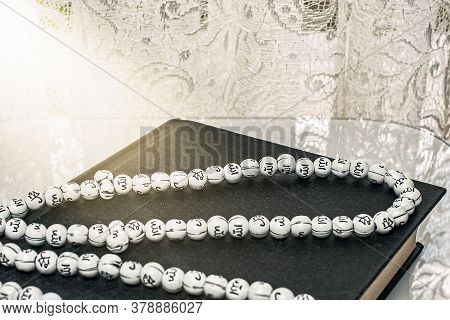 The Koran Is The Holy Book Of Muslims. Traditional  Wooden Prayer Beads