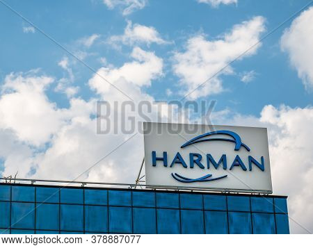 Bucharest/romania - 07.18.2020: Harman International Industries Logo Against Blue Sky, In Bucharest