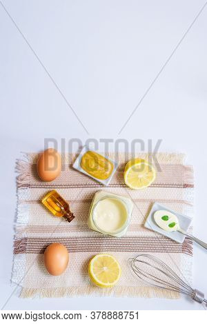 Mayonnaise Eg Oil Lemon Mustard And Wire Whisk. Top View Copy Space Vertical Photo