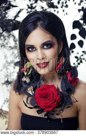 Pretty Brunette Woman With Rose Jewelry, Black And Red, Bright Make Up Kike A Vampire Closeup Red Li