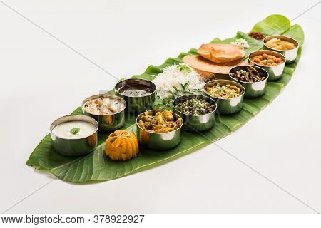 South Indian style Lunch Or Dinner Meal Or Food Served With A Selection Of Recipes Over Banana Leaf