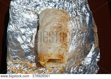 Burrito. Chicken or Steak Burrito in a Foil Wrapper. Burrito with Chicken, Rice, Cheese, Salsa, Beans, Onions grilled to perfection. Lunch or Dinner Menu. Burritos are enjoyed world wide. 
