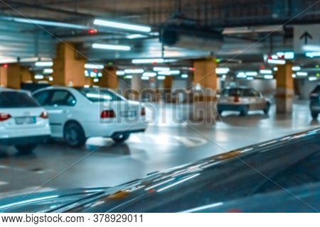 Garage Car Blurred. Car Lot Parking Space In Underground City Garage. Empty Road Asphalt Background 