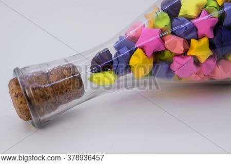In A Closed Glass Bottle Paper Crafts In The Form Of Colorful Stars