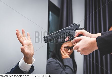 A Group Of Workers Arguing Violently A Woman With A Gun Will Shoot At A Man In The Office.