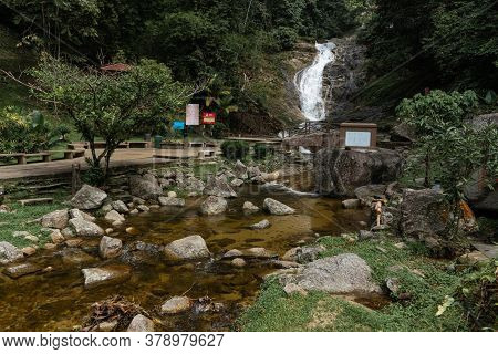 Mountain River Flowing Over The Stones. Wildlife Beauty In Malaysia