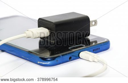 Mobile Phone Charging Cable White - Black On A White Background. Taken In A Studio In My House With 