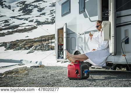 Relaxed Caucasian Man In His 40s On His Rv Vacation Enjoying Morning Coffee In High Mountains While 
