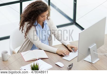 Successful Female Grapic Designer Watching Tutorial About Creative Ideas At Laptop
